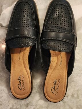 Clarks Black Perforated Slip-On Mules with Tan Insole
